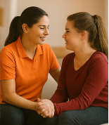 Support Workers “Support worker assisting an adult with daily living skills in a supported living environment